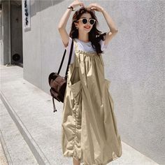 Elevate Your Style with the Springtime Cotton Lantern Dress Lantern Skirt, Skirt With Suspenders, Lantern Dress, Linen Midi Skirt, Cotton Blends Dress, Suspender Skirt, Suspender Dress, Spring Wardrobe, Contemporary Fashion