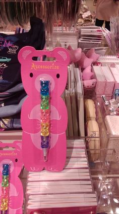 there are many items on display in the store, including toothbrushes and gummy bears