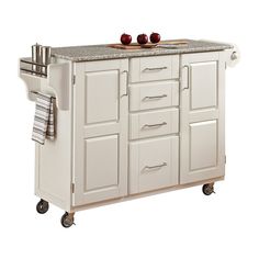 a white kitchen cart with two apples on top