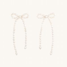 Time to tie those loose ends up into beautiful bows, the saying goes. A sweet and cleverly constructed pair of big bow earrings, made of tiny pearls. We worked with designer Kara Yoo on this specially-sized version, perfect to bring delight to your everyday. White Pearl Earrings With Bow For Wedding, White Pearl Earrings With Bow For Party, Formal Pearl Earrings With Bow Detail, Formal Pearl Earrings With Bow, Elegant Earrings With Satin Bow For Gift, Elegant Earrings With Satin Bow As Gift, Elegant Bow Tie Earrings For Wedding, Elegant Bow Pearl Earrings, Personalized Charm Necklace