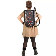 a woman is standing with her back to the camera and has a backpack on it