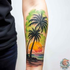 a man's arm with a palm tree and sunset on it