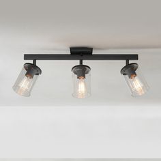 three light fixture with clear glass shades