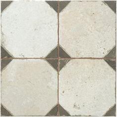 a white and black checkered tile floor with brown grouting on the edges