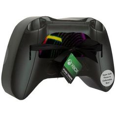 a video game controller with a tag attached to it's side and an ad for xbox