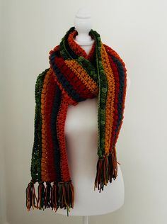 This boho extra long scarf is hand made with acrylic yarn and a variety of shades. This is a long scarf for the scarf lovers who like to wrap around your neck a couple of times. the scarf is  approx. 7 feet (90" long).   Want something a little different? I can definitely make you something with colors of your choice and length you would prefer. with or without the fringe.  The possibilities are endless ❤️ Bohemian Knitted Scarves, Bohemian Knitted Yarn Scarves, Bohemian Crochet Scarves For Winter, Green Bohemian Scarf For Fall, Handmade Yarn Scarves One Size, Bohemian Knitted Winter Scarves, Bohemian Crochet Yarn Scarves, Bohemian Acrylic Yarn Shawl For Winter, Multicolor Yarn Shawl For Fall