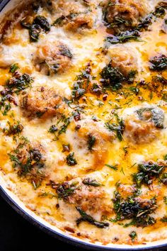 a casserole dish with meatballs and cheese