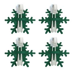 four forks and two spoons are arranged in the shape of snowflakes