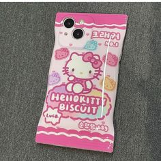 a hello kitty cell phone case sitting on the ground