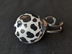 This resin ring features a hand painted cow pattern. The band of this ring is sturdy and adjustable to fit a variety of sizes. Rings may have minor imperfections or a couple small bubbles. Unique Hand Painted Adjustable Rings, Adjustable Hand Painted Round Rings, Cow Pattern, Resin Ring, Stainless Steel Band, Rings Statement, Statement Rings, Favorite Jewelry, Bubbles