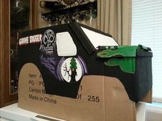 a cardboard car made to look like it is in the shape of a skeleton on top of a box