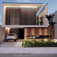 a car is parked in front of a modern house