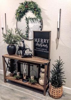 a shelf with christmas decorations on it and a merry sign in the corner next to it