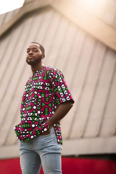 The African Spirit collection is finally here. This collection is all about capturing the heart and soul of Africa in our clothing, using traditional prints, and supporting creative African talent every step of the way! This African shirt is made with electric pink Samakaka sourced directly from Angola. Wear the spirit of Africa with you wherever you go with this beautiful T-shirt We are a brand with a purpose! All our clothing is handmade in Africa, by Africans, with the aim of providing full-time and sustainable employment to as many local tailors and fabric merchants as possible. That is why we are more than just a clothing brand. Read our full story on www.continentclothing.com Hamed Top features-          Simple Design     3 Buttons     2 Hidden Side Pockets     Comfy fit     100% Afr Printed Cotton Half Sleeve T-shirt, Multicolor Short Sleeve T-shirt For Festivals, Multicolor Half Sleeve Relaxed Fit Top, Multicolor Relaxed Fit Half Sleeve Top, Half Sleeve Printed Cotton T-shirt, Printed Half Sleeve Cotton T-shirt, Pink Cotton T-shirt For Festivals, Printed Cotton Half-sleeve T-shirt, Pink Cotton Festival T-shirt