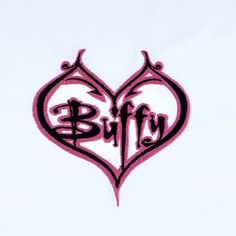 an embroidered heart with the word blfry written in cursive writing on it