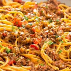 a plate full of spaghetti with meat and cheese on it, next to an image of the same dish