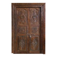 an old wooden door sitting on top of a stone floor next to a brick wall