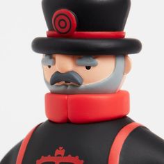 a close up of a toy soldier wearing a top hat