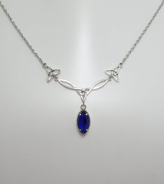 This is a new handmade necklace. It is made with antiqued silver plated Celtic knots, accented with a high quality DARK SAPPHIRE BLUE glass jewel that sparkles like crystal. Decorated portion is 2 1/2" wide and 1 1/4" tall in the center. Necklace is adjustable 15-18" with a lobster clasp and chain extender. If you would like a different length, please send us a message.Matching earrings and headpiece are listed in our store in a variety of stone colors. If you don't see items with a color you wa Faceless Assassin, Allura Vysoren, Dark Blue Jewelry, Ring Book, Celtic Goddess, Fun Clothes, Celtic Knots, Dark Sapphire, Blue Accessories