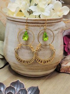 These gorgeous modern earrings will add instant boho vibe to your look.  Raw brass Vintage peridot crystal drops Brass ear hooks Nickel and Lead free Length 2.5" Created in studio - Wilmington, NC Peridot Crystal, Zipper Charms, Wilmington Nc, Crystal Drop, Ear Hook, Modern Earrings, Boho Vibe, Raw Brass, Moon Phases