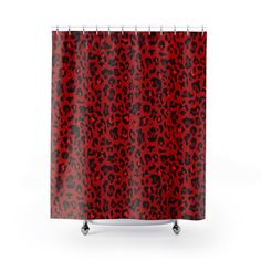 a shower curtain with red and black leopard print on it's side, in front of a white background