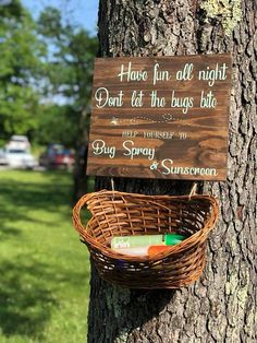 a sign on a tree that says, have fun all night don't let the bugs bite