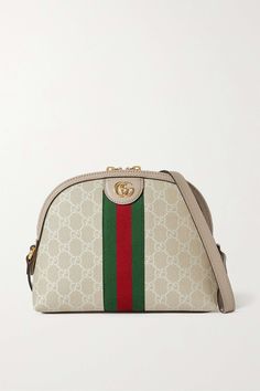 Gucci proves once again that its bags gain cult status as soon as they debut - it wasn't long after the Resort '18 runway before we saw this 'Ophidia' style on the arms of editors and influencers. Made from printed coated-canvas, it's trimmed with beige textured-leather and the house's signature green and red webbing. We're struggling to think of outfits that it won't work with. Gucci Cream Bag With Removable Pouch, Gucci Cream Shoulder Bag For Travel, Cream Gucci Shoulder Bag For Travel, Gucci White Bag With Removable Pouch, White Gucci Bag With Removable Pouch, Ophidia Gg Small Shoulder Bag, Women's Bags By Color, Gucci Ophidia, Print Coat