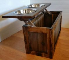 an elevated dog bowl stand with two bowls on it