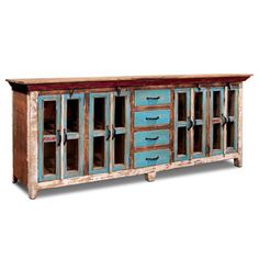 an old wooden cabinet with glass doors on the top and bottom, in blue tones