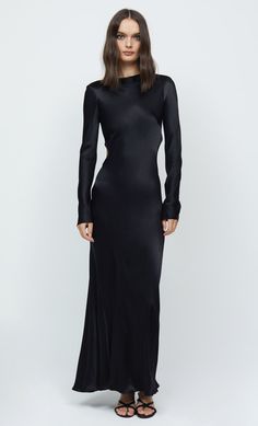 A statement eventwear style, the Ren Long Sleeve Midi is cut on the bias from a luxe speciality fabric. Dress features a slight boat neckline, exaggerated long sleeves with raw edging, an open low-cut back with fabric tie details and is finished with a rolled hem. This garment is certified Australian Made.