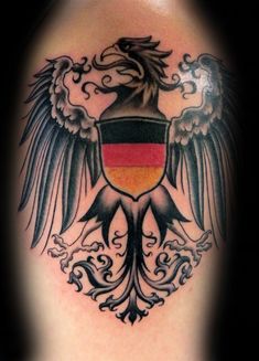 a tattoo with an eagle and german flag on it