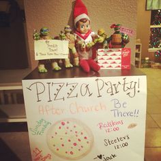 a pizza party sign with an elf on it