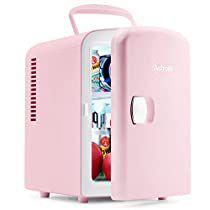 a pink refrigerator with its door open