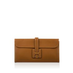 Crafted from luxurious and supple Epsom leather, Hermès presents their magnificent Jige Elan Clutch bag. Available in a range of sizes, the Jige Elan 29 in gold may well be the most eye-catching of them all. The flat clutch features a marvellous silhouette alongside magnificent white contrast stitching. Its signature Jige H closure opens to reveal a leather lined interior which matches its excellent exterior. Whether you are heading to a wedding or dinner, do it in effortless style with the Jige clutch. SPL Exterior Signature Hermès Gold Epsom leather White contrast stitching Signature jige ‘H’ closure Excellent exterior condition - very subtle creasing on base Interior Gold Leather lining Single storage compartment Comes with dustbag Excellent interior condition SPL Height 16cm Width 29cm Hermes Jige, Chanel Classic Flap Bag, Classic Flap Bag, Togo Leather, Gold Interior, Dior Shoes, Classic Flap, Gold Leather, Chanel Handbags