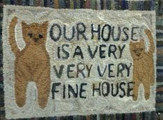 a rug with two cats on it that says our house is avery very fine house