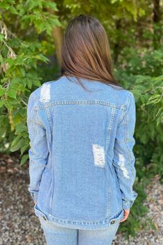 This denim jacket is longer and has fun distressed details to it! The front has buttons all the way down. Throw on over a dress or white tank and leggings for a comfortable look! Alana is 5'4” and wearing her true size Small. Small: Bust 19.75", Length 26" 90% Cotton, 10% Polyester Boyfriend Jean Jacket, Light Blue Jean Jacket, Distressed Boyfriend Jeans, Boyfriend Jean, Blue Jean Jacket, Way Down, White Tank, Small Bust, Boyfriend Jeans