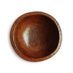 a wooden bowl on a white background