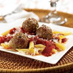 some meatballs and pasta on a plate