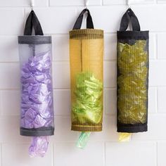 three different colored bags hanging on the wall