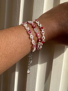 The Beaded Flower Crystal Bracelet is made of quality materials including clear, pink, red, and white shell glass beads and 4mm pink, red, and clear glass crystal beads ✨ - 100% handmade - Premium quality glass Czech beads - Durable transparent nylon thread - Lobster clasp closure with 2in extension chain  You can choose between pink, red, or pink and red and what length you desire your bracelet to be! Please note that orders may take up to a week to ship because all jewelry is handmade ❤️ *Although bracelets are made with the best quality materials, it's still recommended that you avoid contact with moisture and liquids and remove your jewelry before showering or swimming. It's also recommended that you remove your jewelry before exercising, sleeping, or other activities that may cause da Red And Pink Beaded Bracelet, Rose Bead Bracelet, Adjustable Red Flower Beaded Bracelet, Red Flower-shaped Beaded Bracelets For Jewelry Making, Adjustable Red Flower Beaded Necklaces, Adjustable Red Flower Beaded Necklace, White Beaded Flower Friendship Bracelets, White Flower-shaped Beaded Friendship Bracelets, Red Flower Bracelets For Jewelry Making