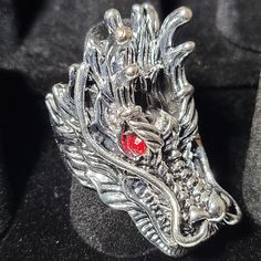 This is a bigger ring with a dragon head and it has red eyes. Gift For Biker, Head Ring, Dragon Head, Big Rings, A Dragon, Red Eyes, The Dragon, Fan, Ring