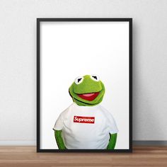 the muppet is wearing a supreme t - shirt in front of a white wall