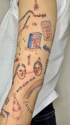 a woman's arm with drawings on it and words written all over the arm