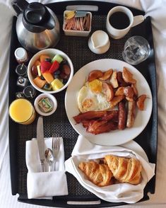 the breakfast is prepared and ready to be eaten on the tray in the hotel room