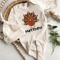 Baby Romper for My First Thanksgiving: Adorable Baby Romper for Cherished Moments We are introducing our enchanting Baby Romper, a delightful choice for My First Thanksgiving festivities. Make this special occasion memorable with a touch of personalization and comfort. Crafted with lo... Thanksgiving Festivities, Babys First Thanksgiving, Thanksgiving Onesie, My First Thanksgiving, 1st Thanksgiving, Romper Fall, Personalized Baby Onesies, Thanksgiving Fashion, Thanksgiving Baby