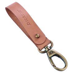 a brown leather key fobl is shown with the word, don't stop