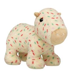 a white stuffed animal with sprinkles on it