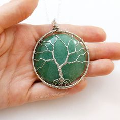 Green Aventurine Tree of Life Necklace / August Birthstone / Silver Wire Wrapped Tree Pendant / Gift for Mom / Gift for Wife / Family Tree Jewelry This tree of life pendant necklace is one of a kind and handmade with a beautiful green aventurine stone wrapped with lovely silver jewelry wire. It hangs on a delicate yet sturdy 2mm silver plated cable chain necklace. The pendant measures around 2.25 inches long by 1.75 inches wide. Necklace lengths are available from 16 inches to 24 inches long. ~ Green Aventurine Stone, Tree Jewelry, Handmade Crystal Jewelry, Wire Wrap Pendant, Aventurine Stone, Stone Wrapping, August Birthstone, Tree Of Life Necklace, Tree Of Life Pendant