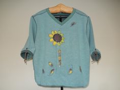 This 3/4 sleeved tunic v neck pullover sunflower sweatshirt is the perfect piece to add to your wardrobe!  You can actually wear this sunflower all year long!  This piece will definitely get you many compliments.   A pair of brown boots would look great with it!  It also makes a perfect original gift for that someone that is so hard to buy for.  It will be the most premium sweatshirt you can get your hands on. You will want to live in this.   Please note, while I do my best to capture highest qu Brown Tie, Tie Design, Tunic Length, Workout Sweatshirt, Pullover Sweatshirt, Light Green, Wearable Art, Sweatshirts Women, Looks Great