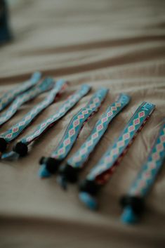 there are many toothbrushes lined up on the bed